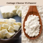 A comparative visual of cottage cheese and paneer, with the left side showing cottage cheese in a dark bowl and the right side displaying paneer on a wooden spoon, labeled ‘Cottage Cheese VS Paneer’ at the top.