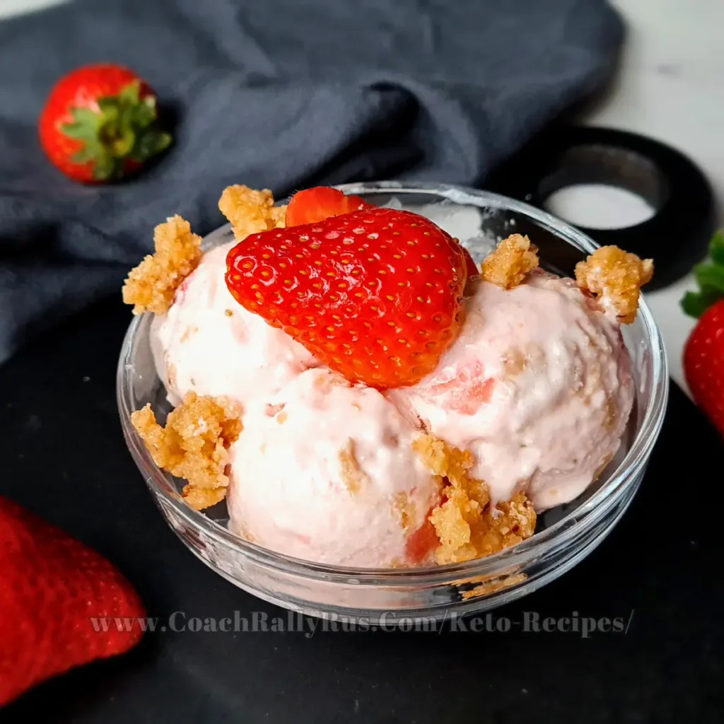 A sumptuous scoop of Keto Strawberry Cottage Cheese Ice Cream, topped with a juicy strawberry and sprinkled with a nutty crumble, served in a stylish dessert bowl, embodying a perfect fusion of health and taste for a low-carb indulgence.