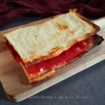 Golden-brown cottage cheese flatbread with a crispy edge, fresh out of the oven, displayed on a light countertop, embodying the simplicity and deliciousness of keto-friendly recipes.