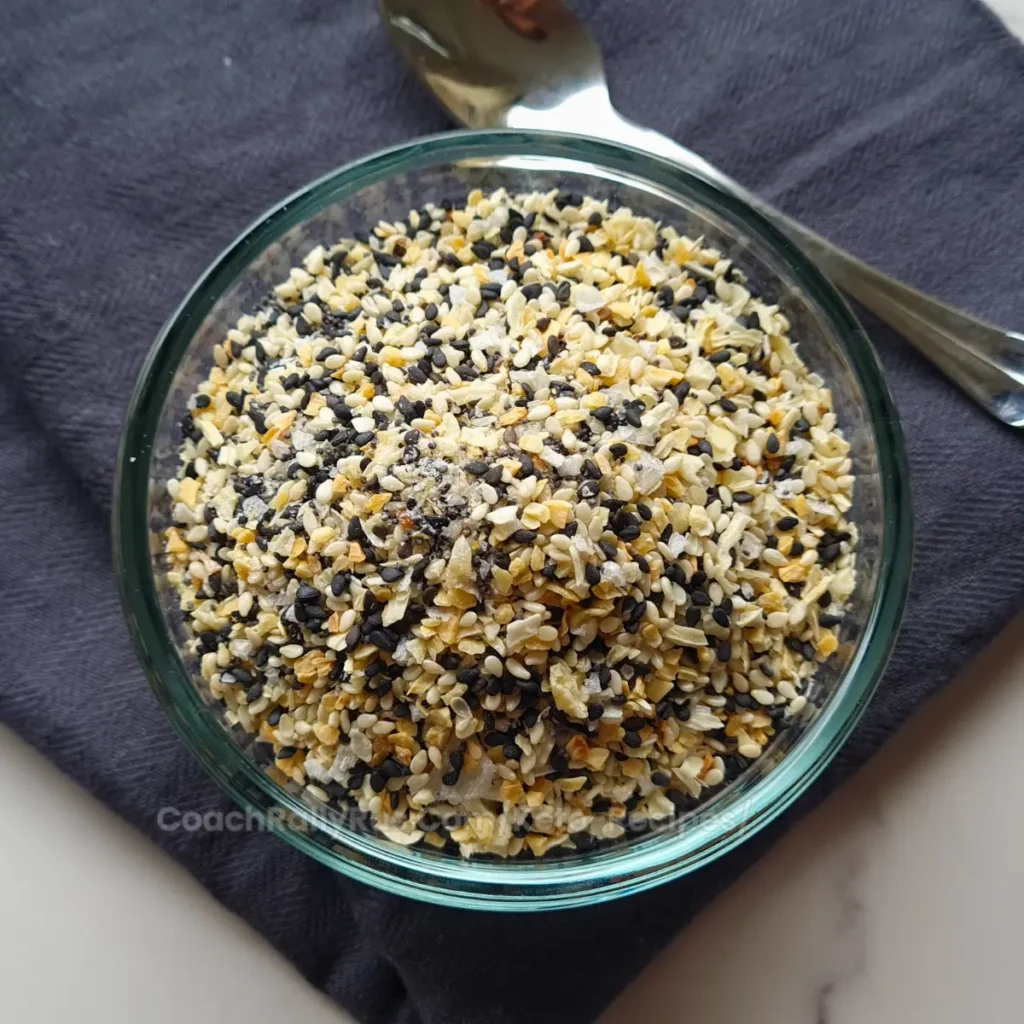A close-up view of Everything Bagel Seasoning in a glass bowl.