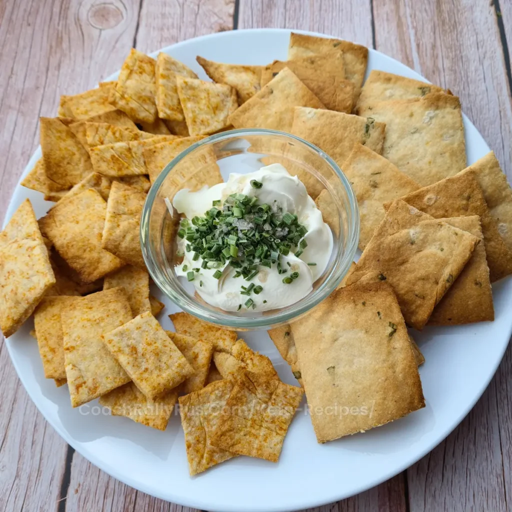3-Ingredient Keto Crackers on a wooden board with a small bowl of dip