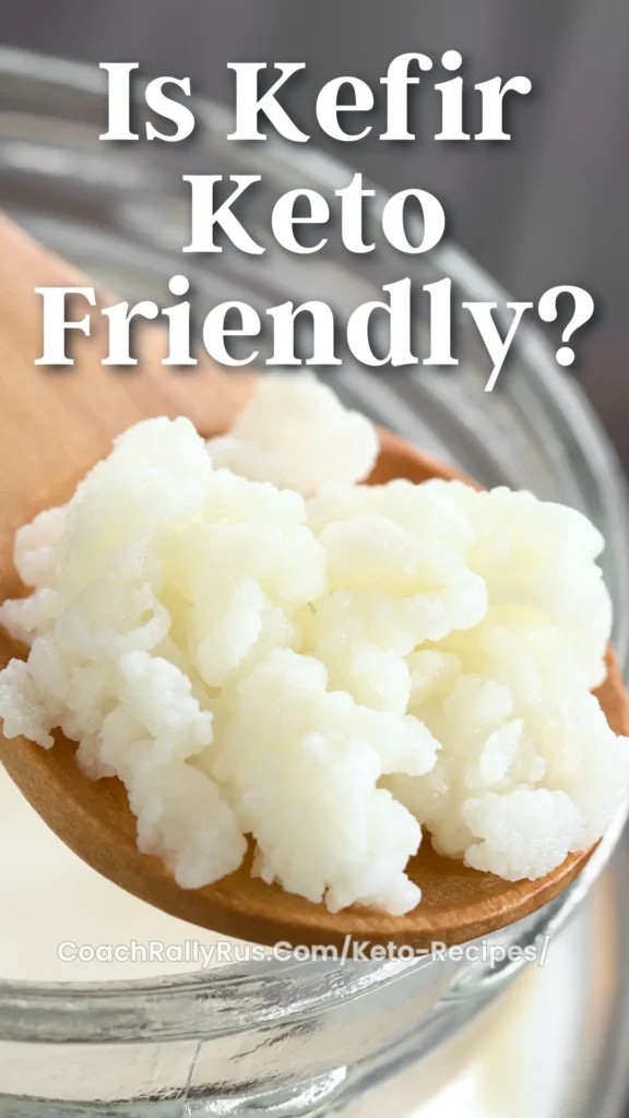 Close-up of kefir grains on a wooden spoon over a bowl of kefir.
