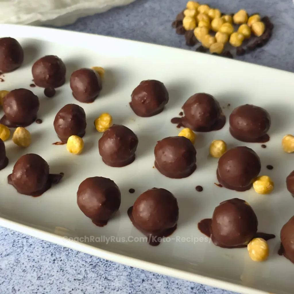 Plate of Keto Chocolate Hazelnut Cottage Cheese Bonbons with hazelnuts - low carb, sugar-free, high-protein keto treat
