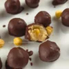 Keto Chocolate Hazelnut Cottage Cheese Bonbon with a bite, showing creamy filling