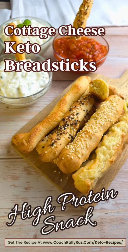 Keto cottage cheese breadsticks served on a wooden board with marinara and creamy dips.