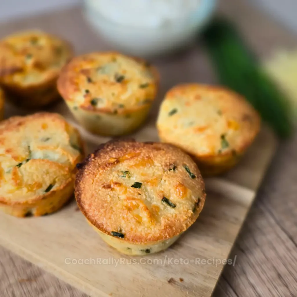 A close-up of keto cottage cheese biscuits with a crispy golden top and fluffy inside.