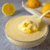 creamy cottage cheese lemon curd in bowl with lemon and spoon