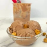 Nutella cottage cheese ice cream in front of a Ninja Creami container.
