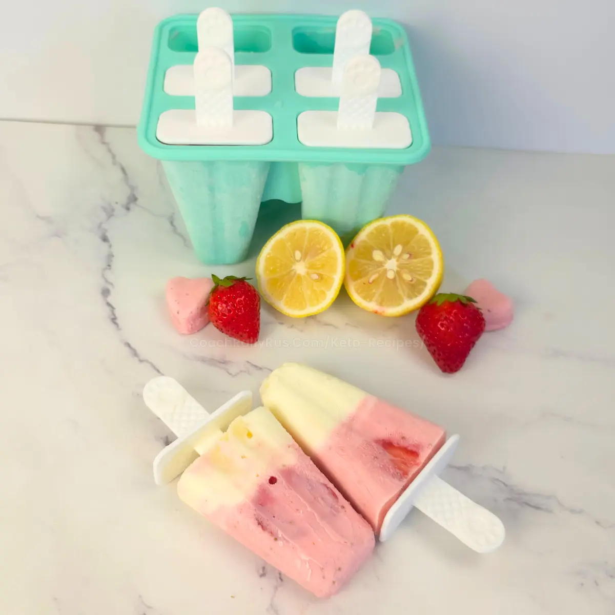 Close-up of keto strawberry lemonade popsicle with real fruit pieces