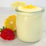 whipped cottage cheese lemon keto fluff in a glass jar with lemon zest on top