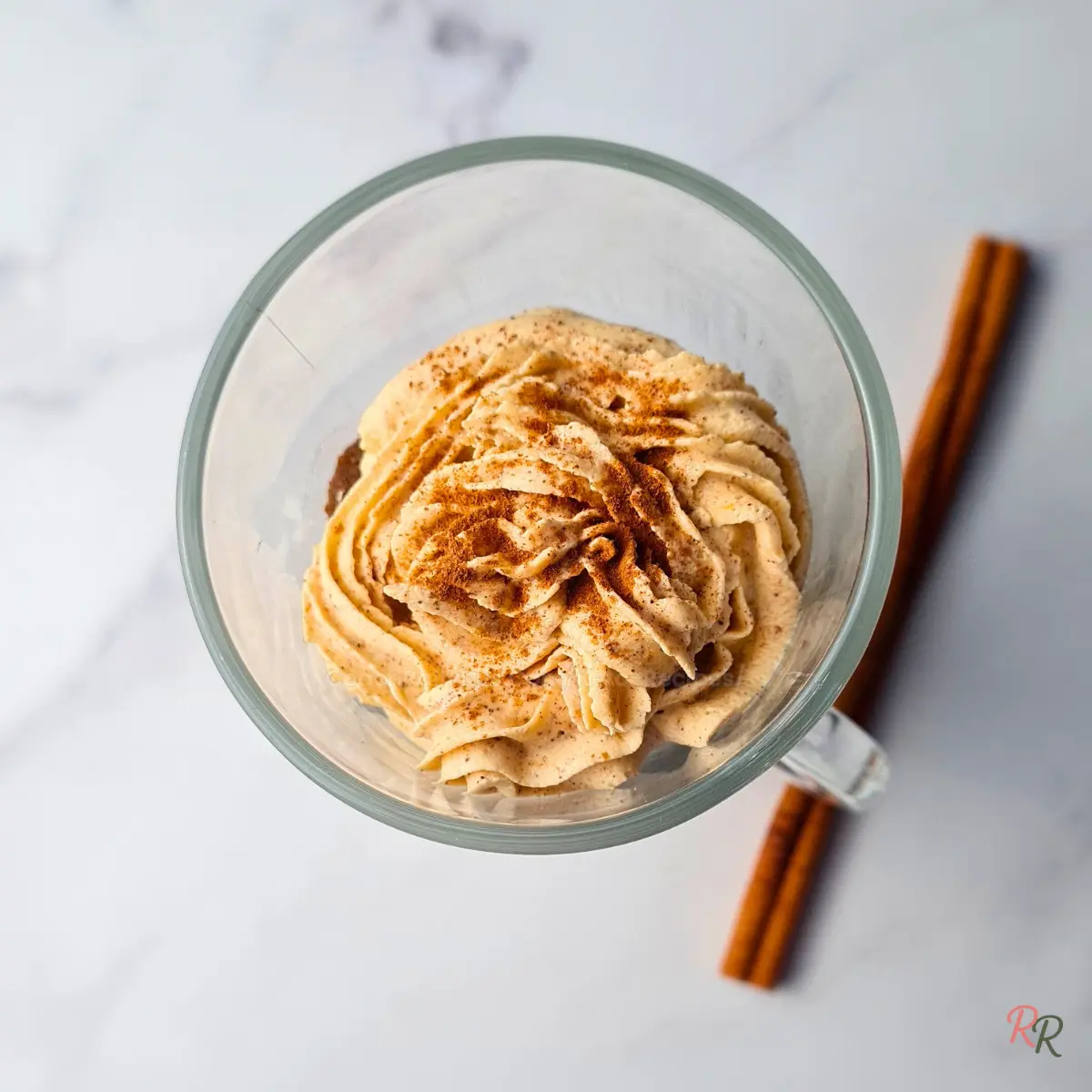 Top view of pumpkin mug cake with cinnamon mousse swirl