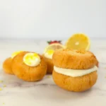 Keto lemon cookie sandwich filled with creamy lemon curd
