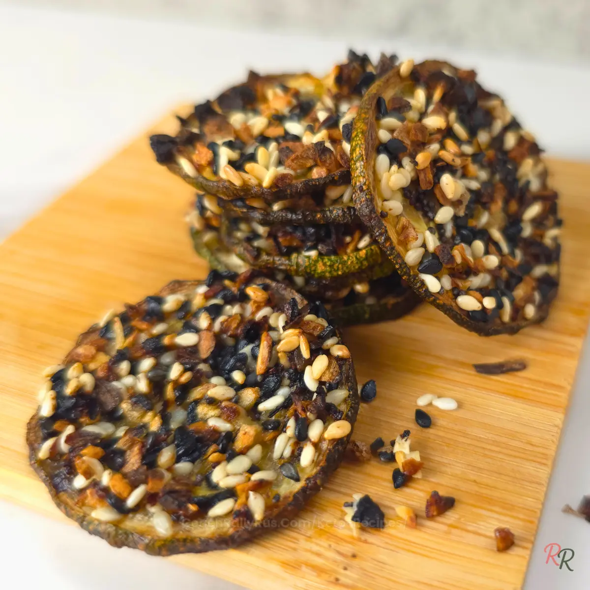 Baked zucchini chips topped with everything bagel seasoning