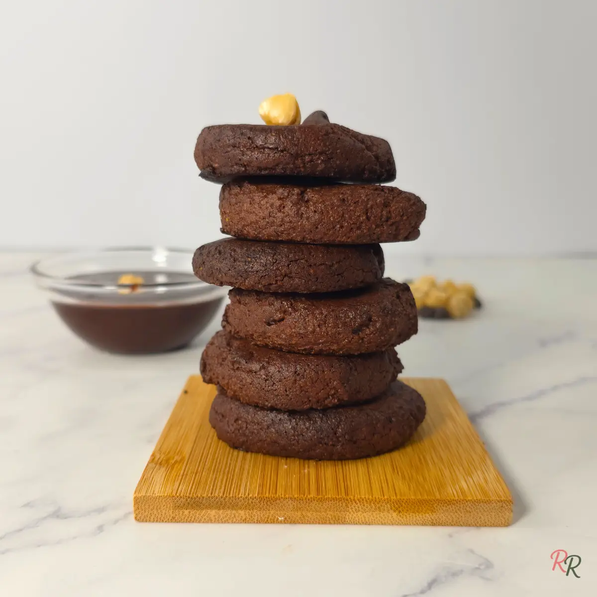 Sugar Free Keto Nutella Cookies with Almond Flour Stack of 3 ingredient keto Nutella cookies on wooden board