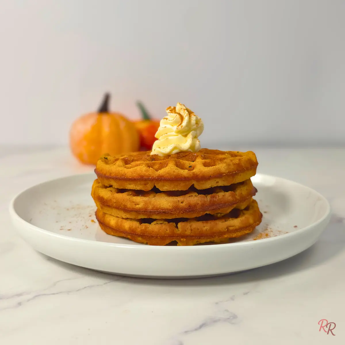 eto pumpkin cottage cheese waffles stacked with whipped cream topping