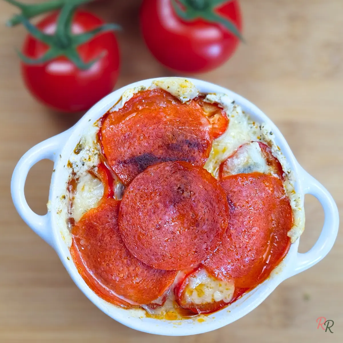 Top view of cottage cheese pizza bowl with pepperoni and melted cheese.