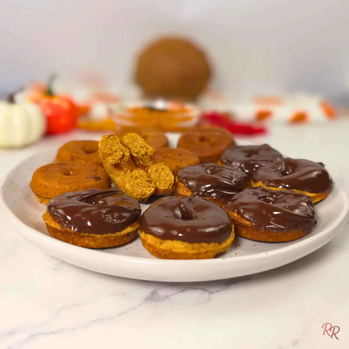 Low Carb Pumpkin Cottage Cheese Donuts - Coconut Flour Side angle of keto pumpkin cottage cheese donuts with coconut flour, chocolate glazed on a plate.