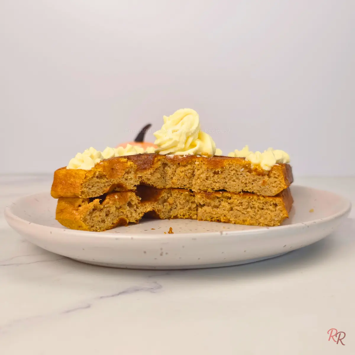Cross-section of pumpkin cottage cheese waffles showing fluffy interior