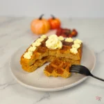 Pumpkin coconut flour waffle with fork and decorative butter swirl