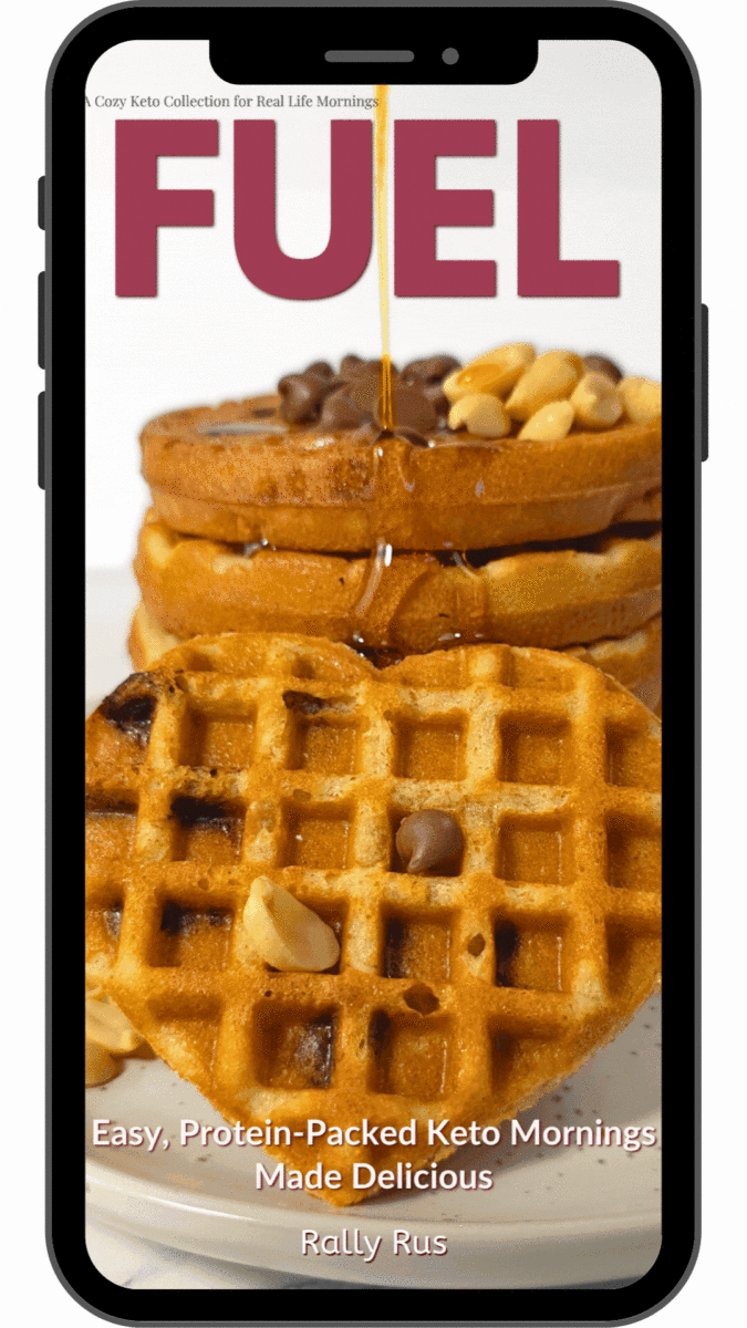 Fuel Keto Breakfast eBook GIF Preview Animated preview of the "FUEL: Easy, Protein-Packed Keto Mornings Made Delicious" eBook cover on a phone screen with syrup dripping over stacked waffles