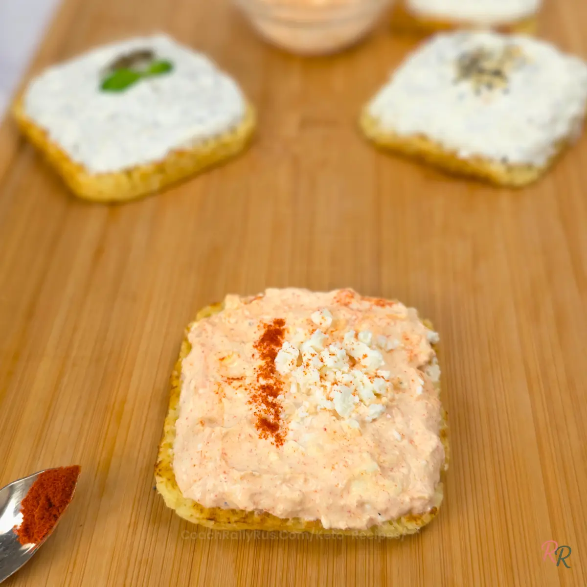Whipped cottage cheese and feta spread on flatbread with paprika sprinkled on top
