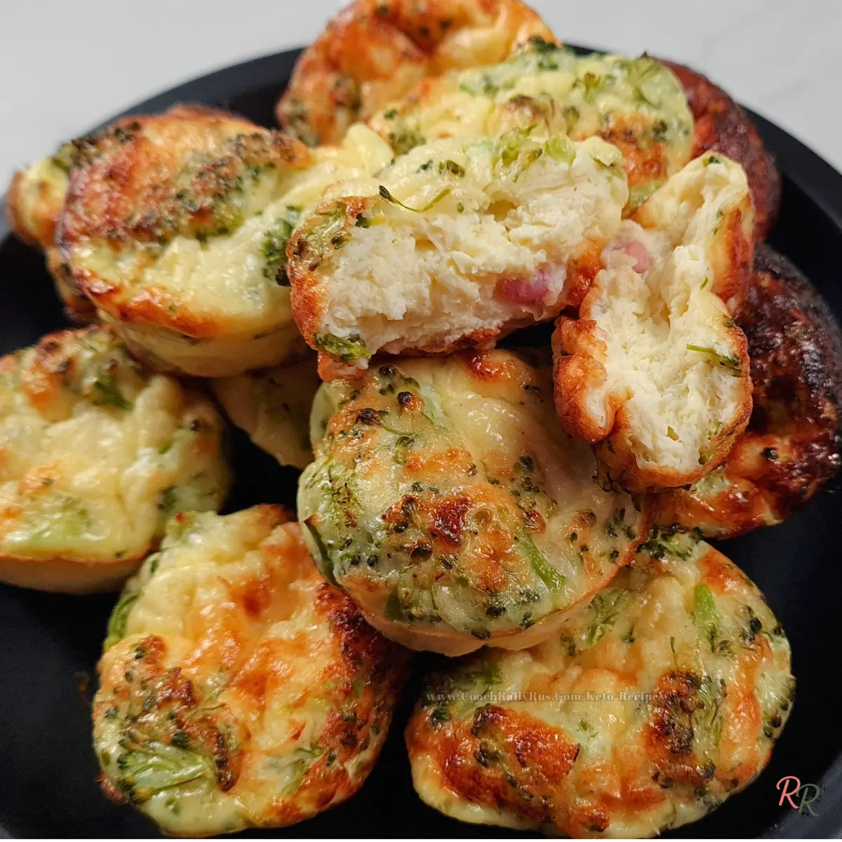 Stack of keto cottage cheese egg muffins with pancetta, one broken open to show the fluffy, moist inside.