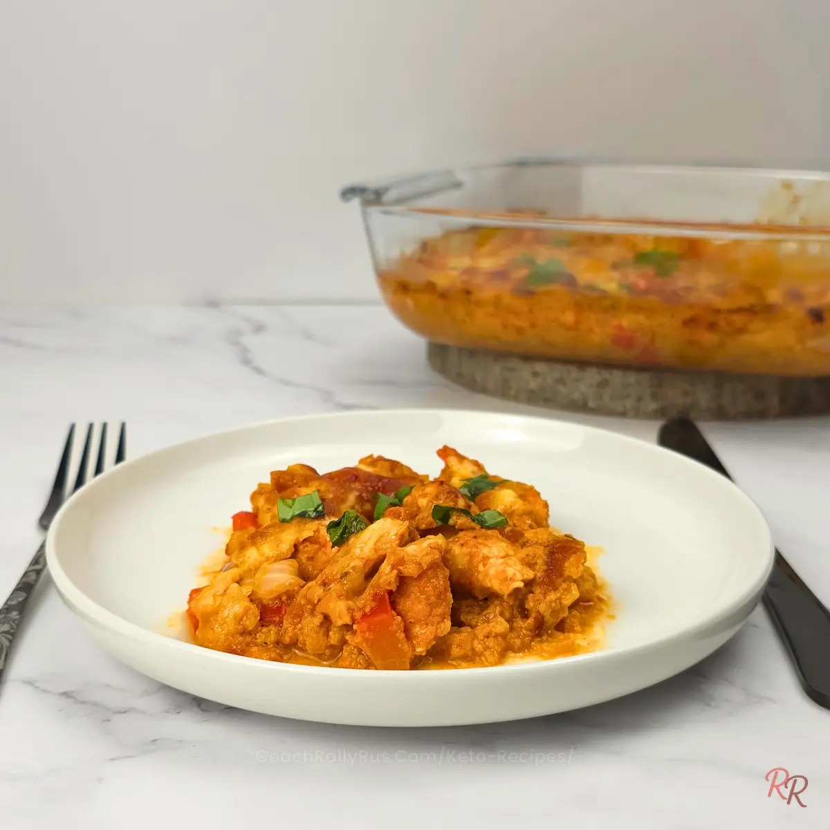 Hearty High Protein Keto Cottage Cheese Taco Chicken Casserole A creamy slice of keto taco casserole with visible chunks of chicken and bell pepper.