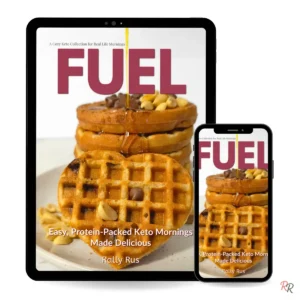 Cover of the 'Fuel' keto breakfast ebook by Rally Rus shown on a digital tablet and phone. Features heart-shaped waffles, drizzled syrup, and cozy protein-packed styling — modern and realistic device mockup.