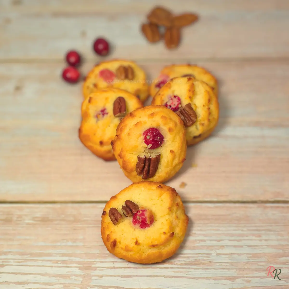 Gluten Free Keto Cranberry Cottage Cheese Cookies Keto cranberry cottage cheese cookies with pecans arranged on a wooden surface, showing their soft texture and golden color