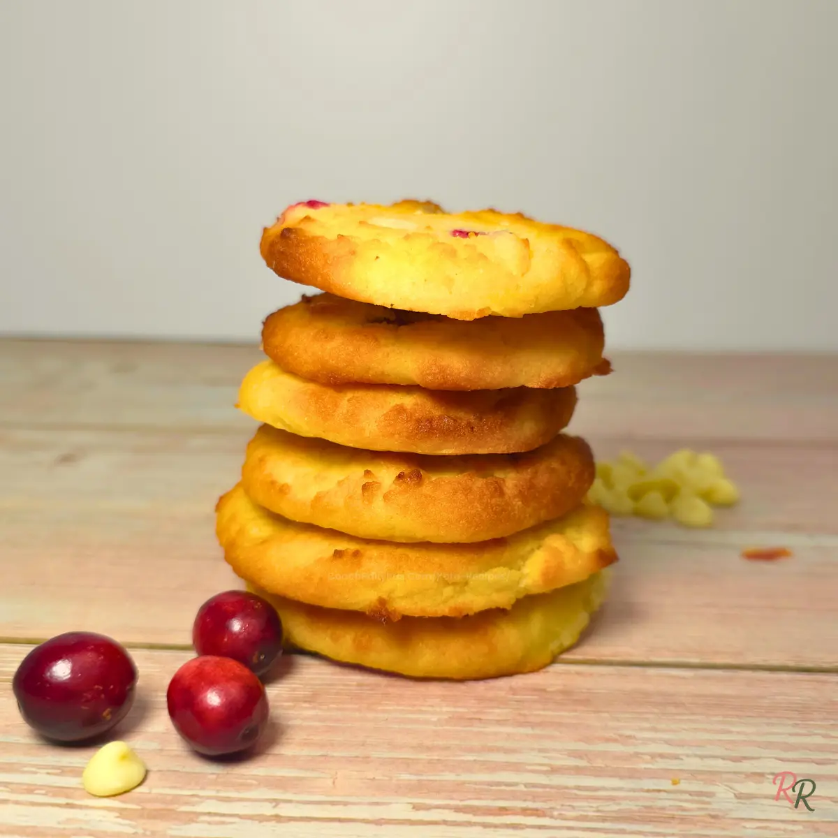 Sugar Free Keto Cranberry Cottage Cheese Cookies with White Chocolate Soft keto cranberry cottage cheese cookies with white chocolate chips on a wooden surface