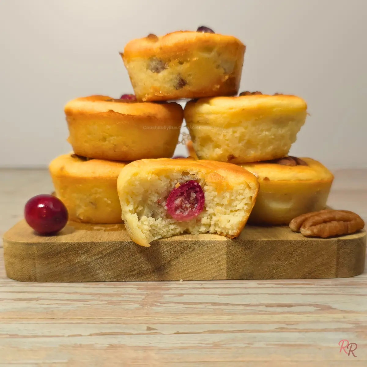 High Protein Keto Cranberry Breakfast Muffins Stacked keto cranberry pecan cottage cheese breakfast muffins with cranberries and pecans