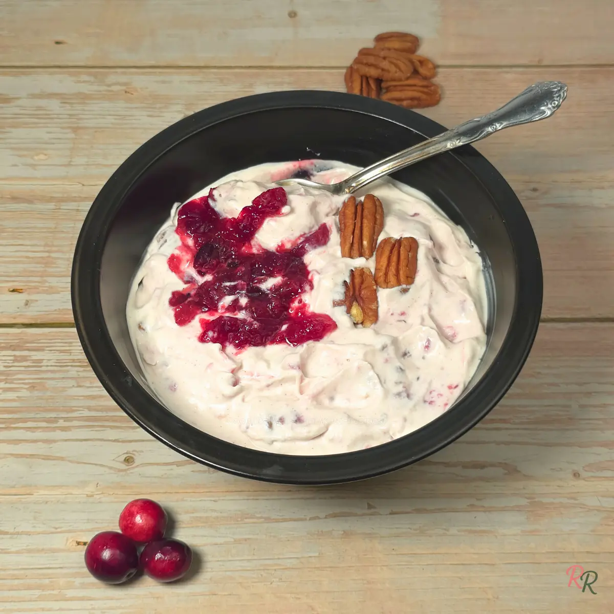 Keto Cranberry Cottage Cheese Salad with Pecans Bowl of creamy cranberry cottage cheese salad topped with pecans.