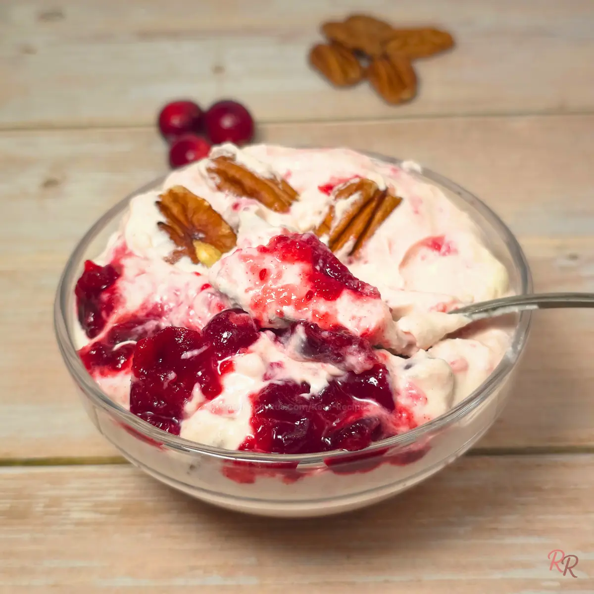 High Protein Keto Cranberry Cottage Cheese Salad with Pecans Keto cranberry cottage cheese salad with pecans in a glass bowl, creamy pink texture with cranberry swirl.